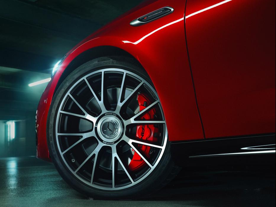 Close-up of a wheel with a brake caliper in AMG red