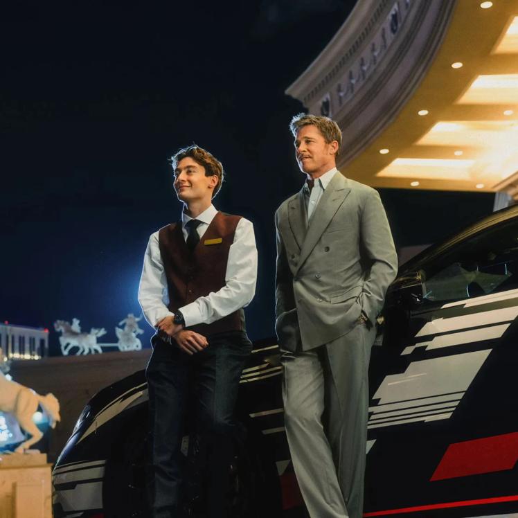 Brad Pitt and George Russell in front of  the new Mercedes-AMG GT 4-Door Coupe prototype.