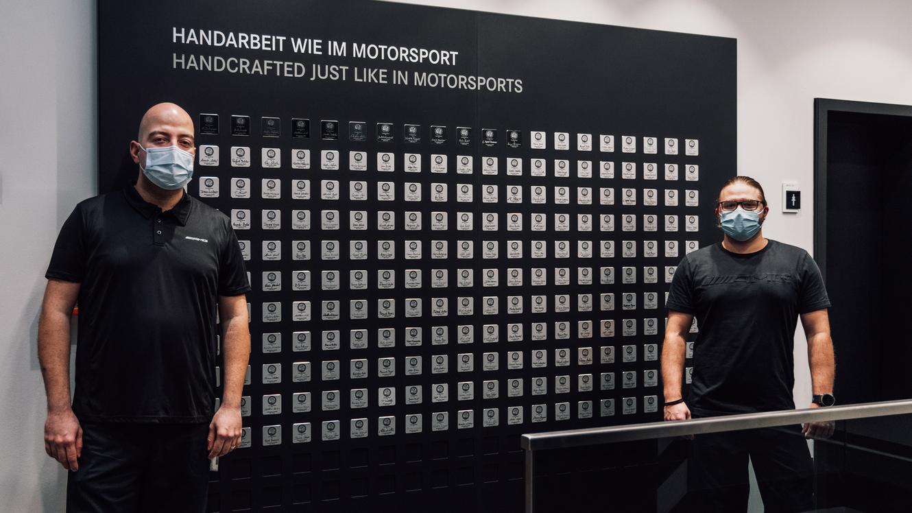 Black Series Employees in front of the black badges