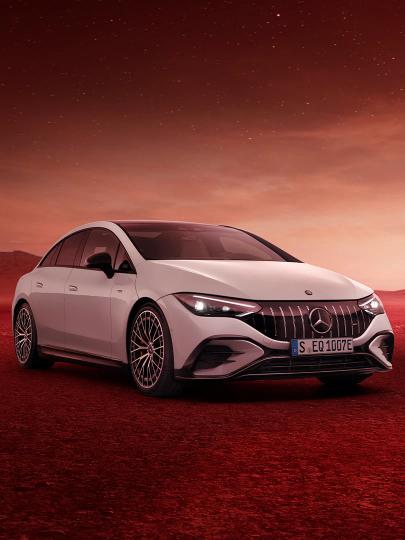 The Mercedes-AMG EQE 53 4MATIC+ in a galatic scenery.