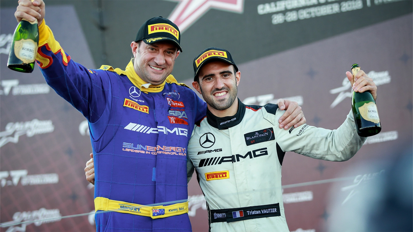 Two GT drivers arm in arm in victory pose