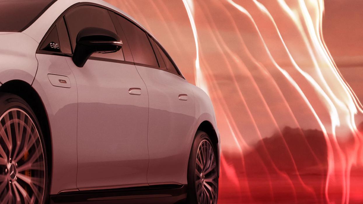 A model posing in front of a Mercedes-AMG EQE 43 4MATIC.