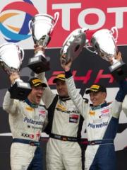 AMG GT racing drivers celebrate on the podium