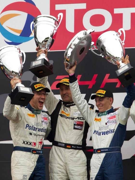 AMG GT racing drivers celebrate on the podium