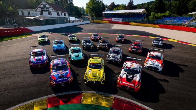 Bird's eye view of several GT racing cars at the CrowdStrike 24 Hours of Spa