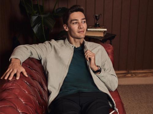 George Russel sitting on a couch