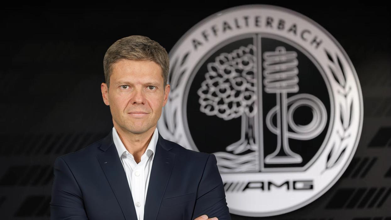 Dr. Stefan Weckbach in a black suit and white shirt smiling at the camera