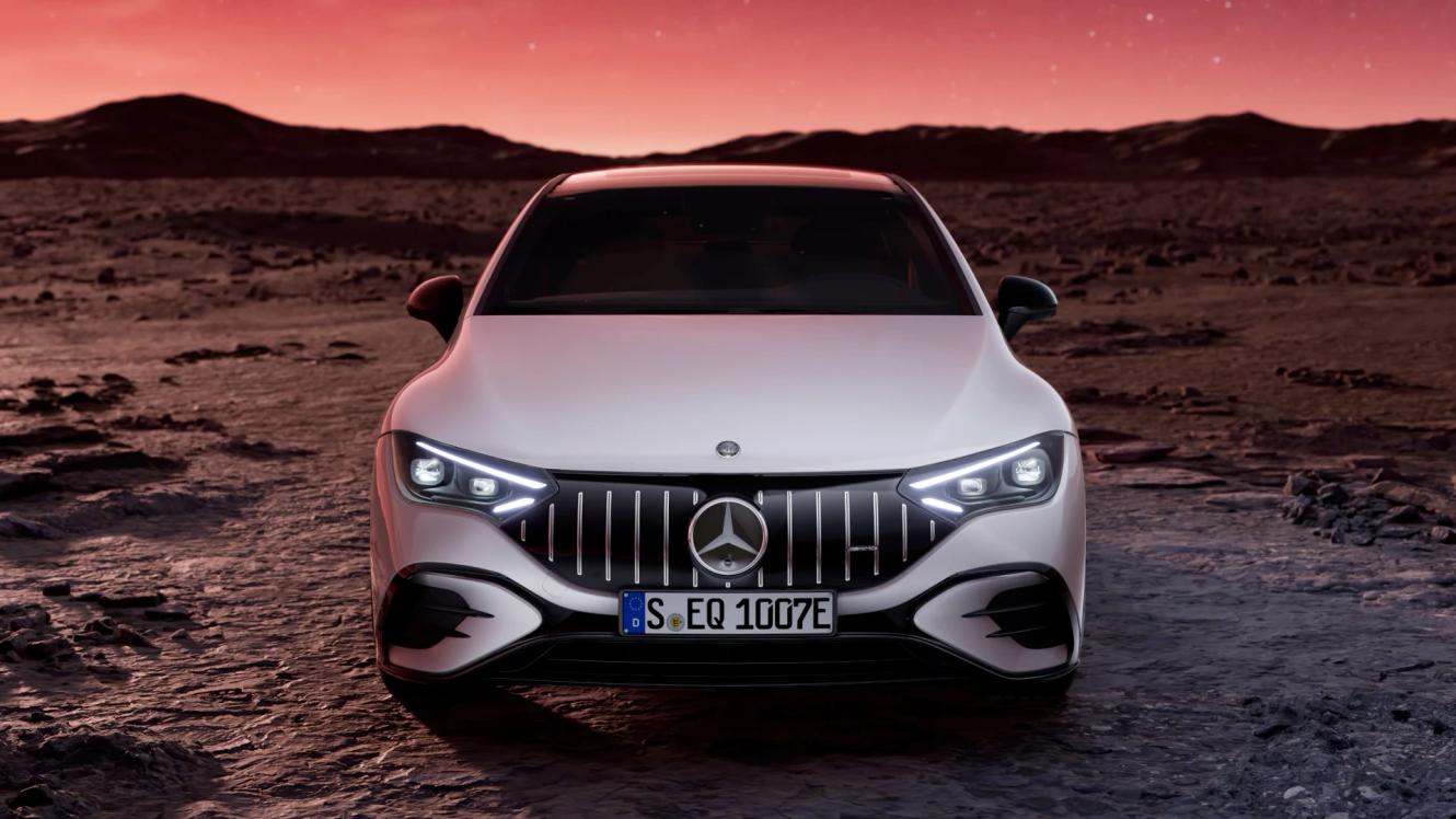 The Mercedes-AMG EQE 53 4MATIC driving in a galactic scenery.