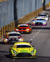 Several Mercedes-AMG GTs drive on the race track