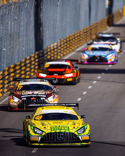 Several Mercedes-AMG GTs drive on the race track