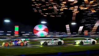 Three Mercedes-AMG GTs with fireworks in the background