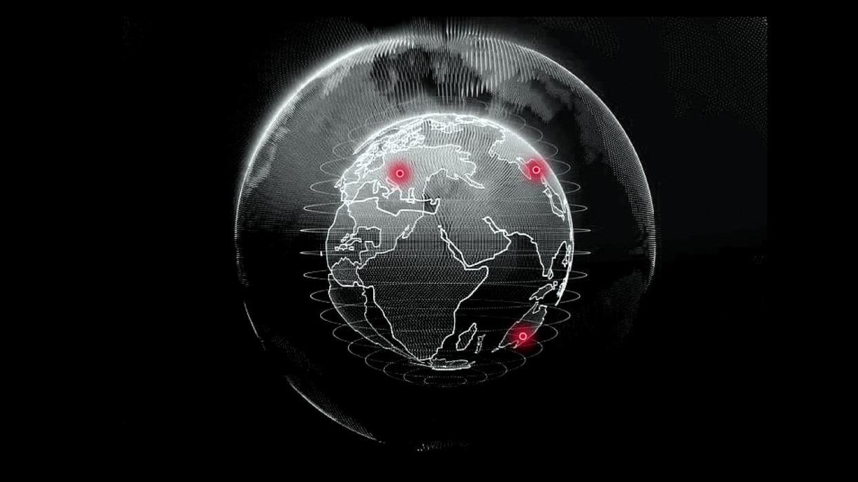 Ein schwarz-weißer Globus mit roten Markierungen in Europa, Asien und Australien