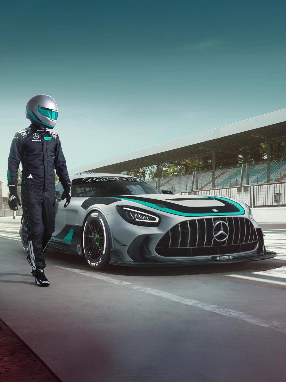 Racing driver runs alongside parked Mercedes-AMG GT2 Edition W16